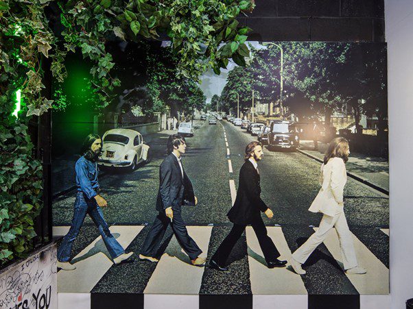the cover art of abbey road by the beatles on display at the beatles story, liverpool