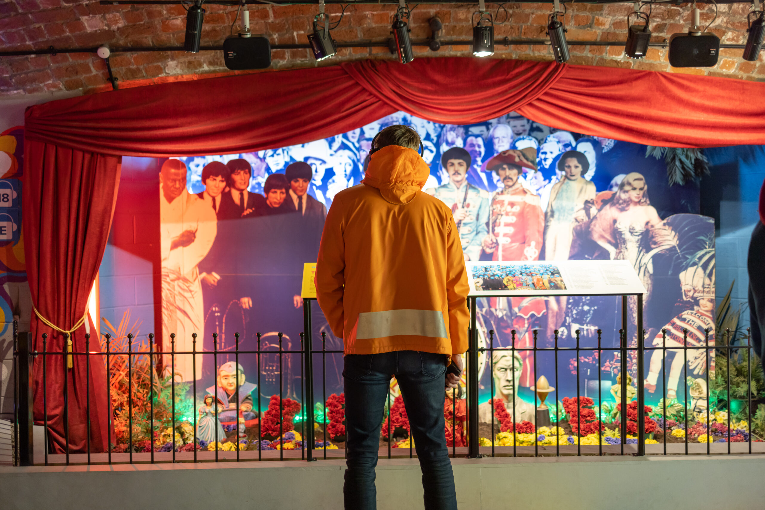 A visitor takes in the life-size display of Sgt. Pepper's album cover at The Beatles Story Museum. Armed with a special map, visitors are invited to uncover the identities of the many famous faces!