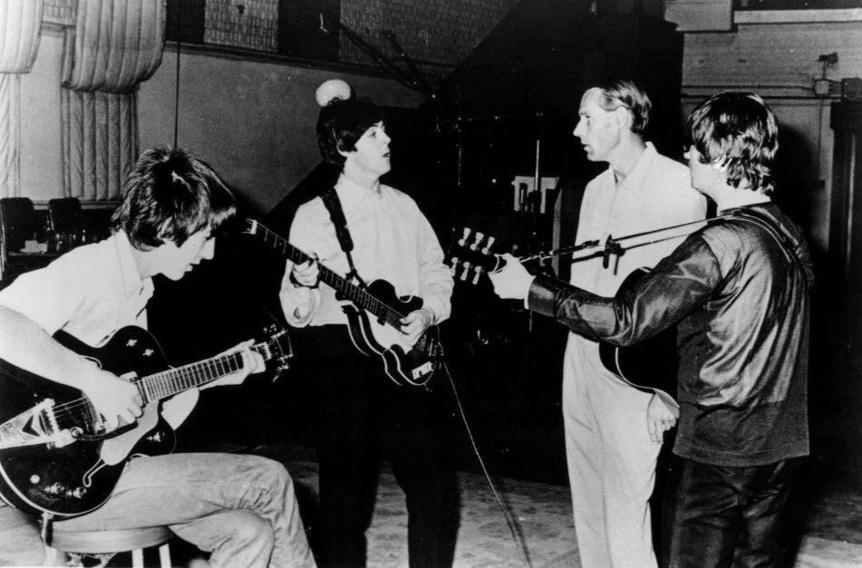 The Beatles and George Martin in Abbey Road Studios.